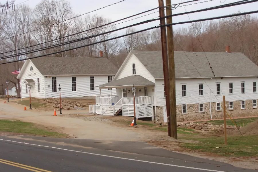 East Haddam Grange and Old Town Hall, two white clapboard buildings, during restoration