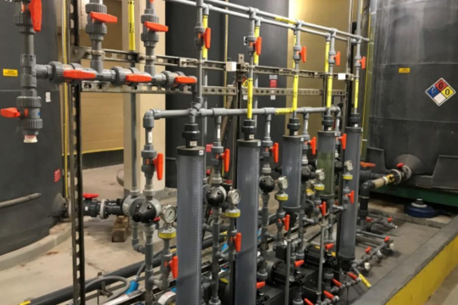 New chemical feed piping manifold with valves and gauges beside the storage tanks at Lake Gaillard