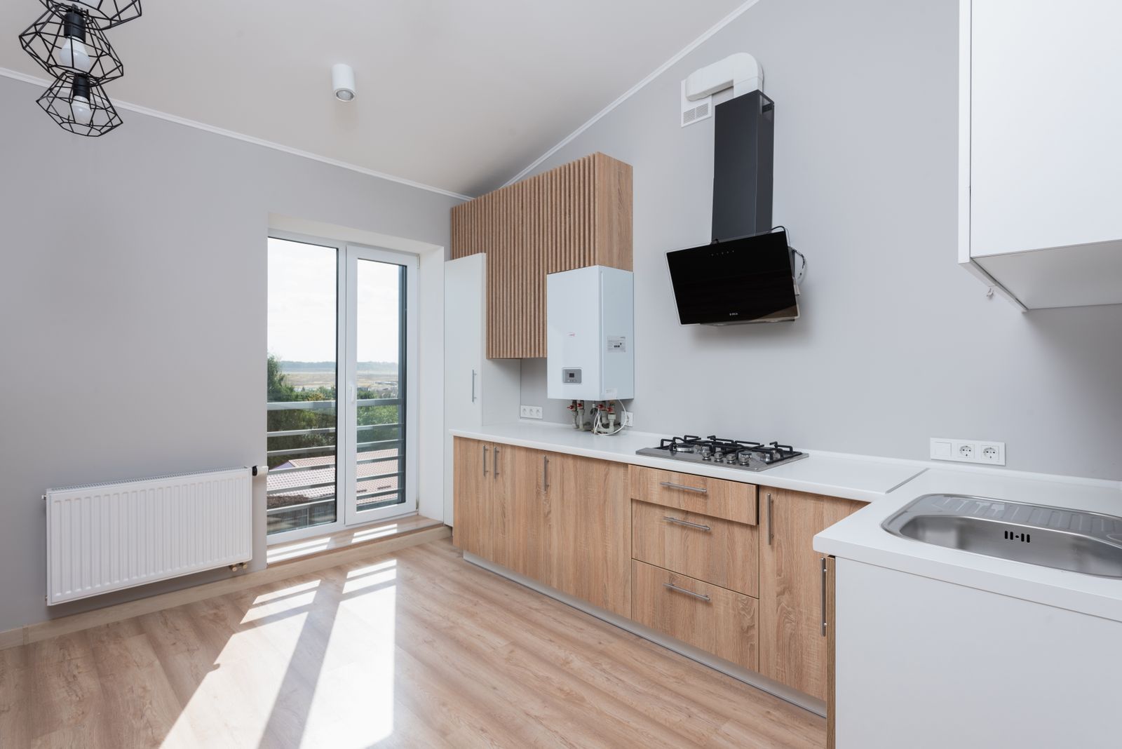 Custom kitchen with wood cabinetry and full-height windows