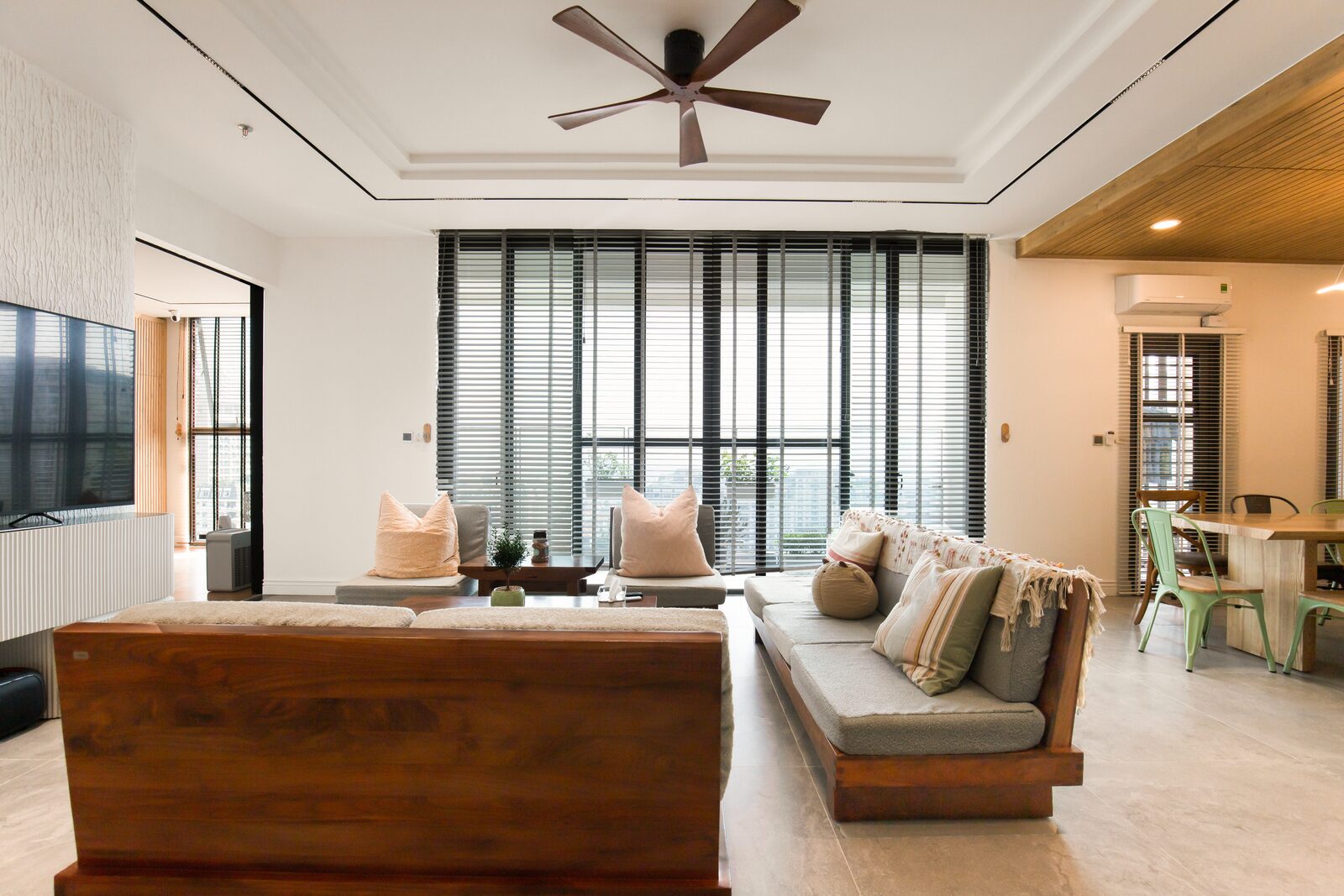 Living room with large windows and layered natural light